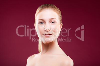 Portrait of a young lady on red