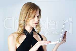 Attractive blonde girl with laptop