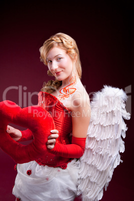 Perfect blonde angel with a red heart