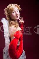 Perfect blonde angel with a red heart