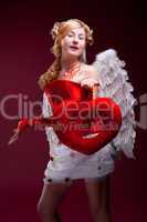 Perfect blonde angel with a red heart