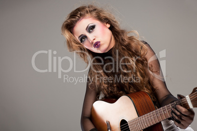 rocker girl with acoustic guitar