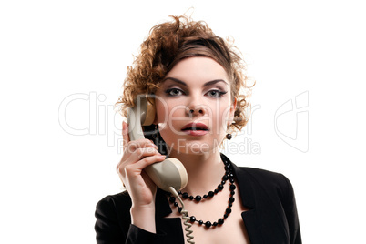 Businesswoman taking telephone call in office