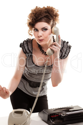 Businesswoman taking telephone call in office