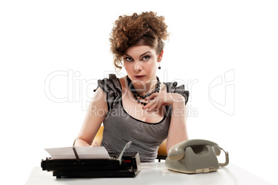 Businesswoman taking telephone call in office