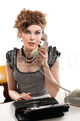 Businesswoman taking telephone call in office
