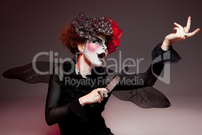 woman mime with knife