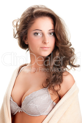 young woman sitting on chair covered with blanket