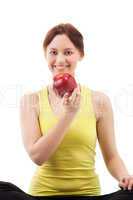 woman in sportswear with apple