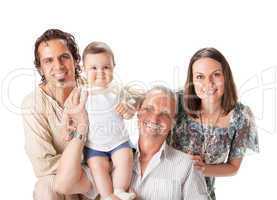 Studio Shot Of Family Group Sitting In Studio