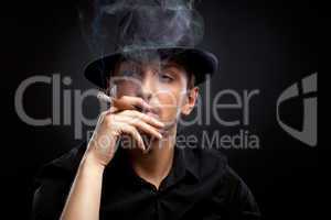 Gangster look. Man with hat and cigar.