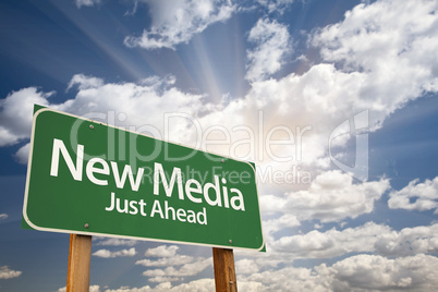 New Media Green Road Sign Against Clouds