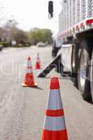 Orange Hazard Safety Cones and Work Truck