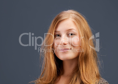 Portrait of red-haired young woman