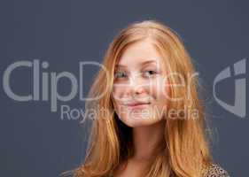 Portrait of red-haired young woman