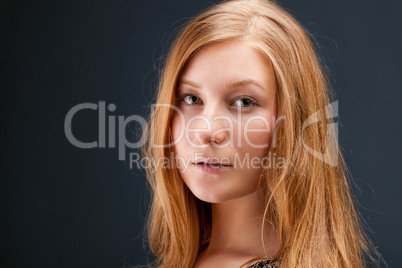 Portrait of red-haired young woman