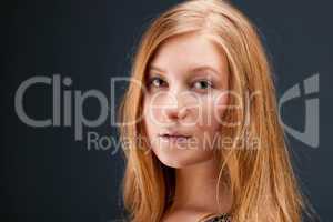 Portrait of red-haired young woman