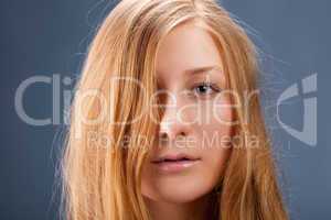 Portrait of red-haired young woman