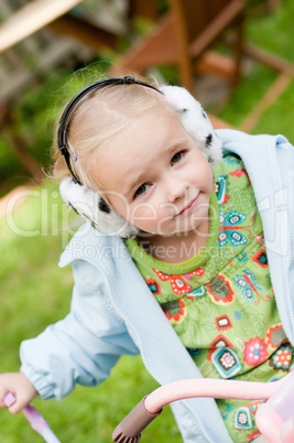 Little girl playing outside