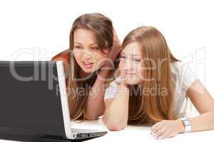 two young happy student girl work on laptop