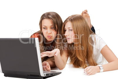 two young happy student girl work on laptop