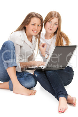 two young happy student girl work on laptop