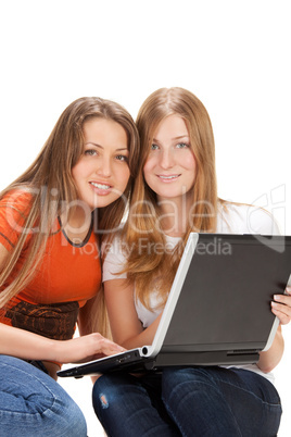 two young happy student girl work on laptop