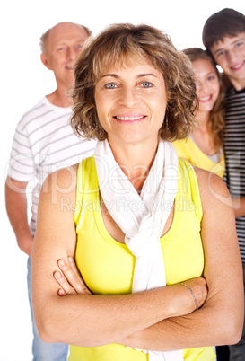 Charming old lady in focus with family in the background