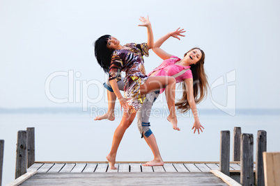 two girl  are dancing