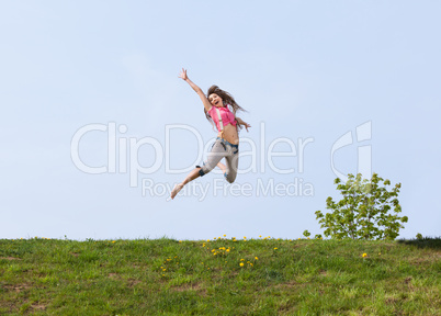 Happy young woman jumping