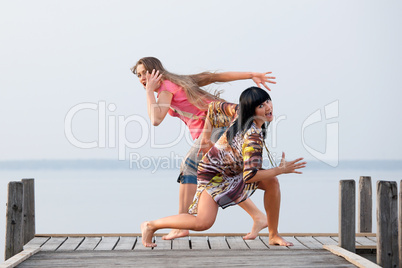 two girl  are dancing