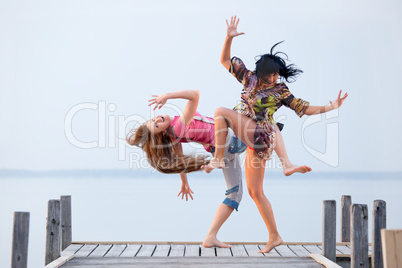 two girl  are dancing