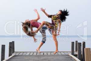 two girl  are dancing