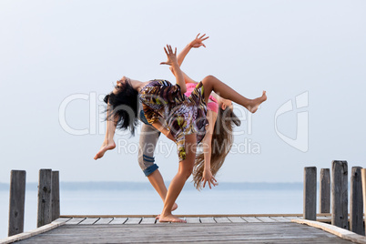 two girl  are dancing