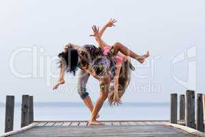 two girl  are dancing