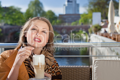 attractive young woman relaxing in cafe