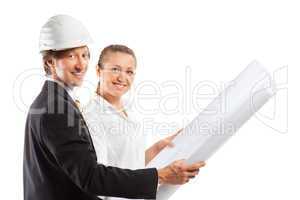An architect wearing a hard hat and co-worker
