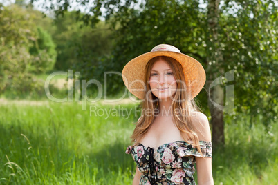 Young beautiful girl with hat posing outdoor