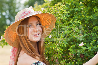 Young beautiful girl with hat posing outdoor