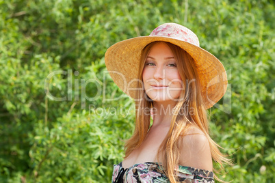 Young beautiful girl with hat posing outdoor