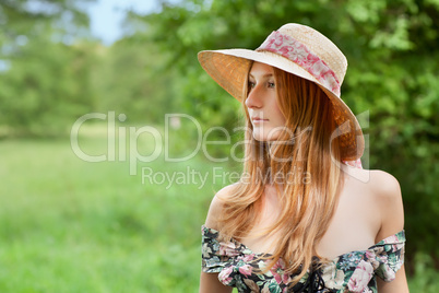 Young beautiful girl with hat posing outdoor