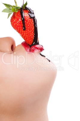 girl eating strawberry with chocolate sauc