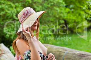 Young beautiful girl with hat posing outdoor