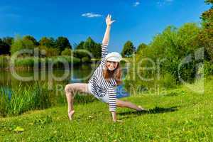 young woman exercising outdoor in summer