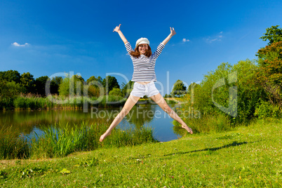 young woman exercising outdoor in summer