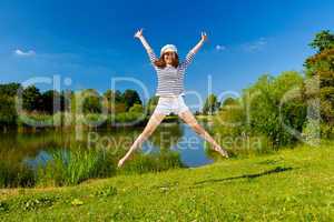 young woman exercising outdoor in summer