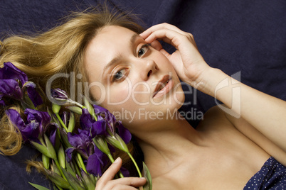 Attractive girl with flowers iris