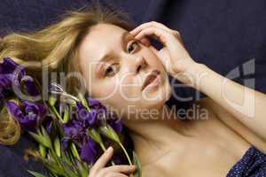 Attractive girl with flowers iris
