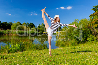 young woman exercising outdoor in summer