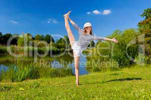 young woman exercising outdoor in summer